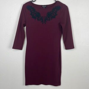 Wine colored sweater dress size small with black detail